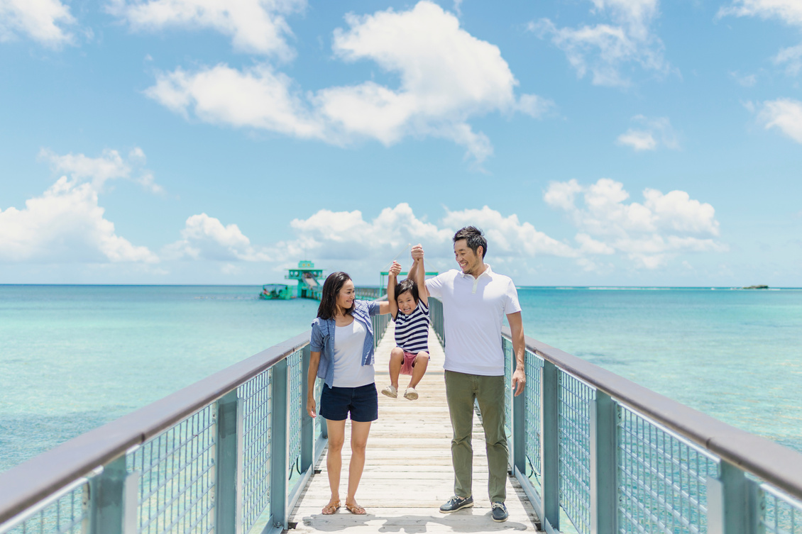 Japanese family walking bridge with smile